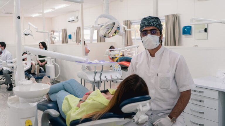 Dentist discussing non-surgical alternatives to wisdom tooth extraction with a patient
