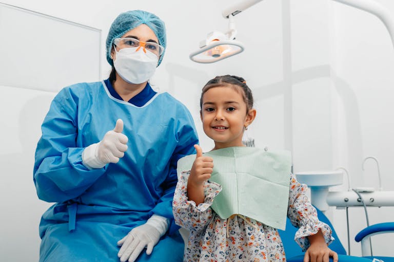 Toddler is calmly in a dental chair during their first dental visit