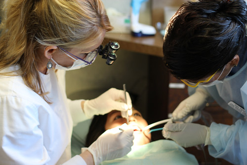 Child at a routine dental checkup with a pediatric dentist